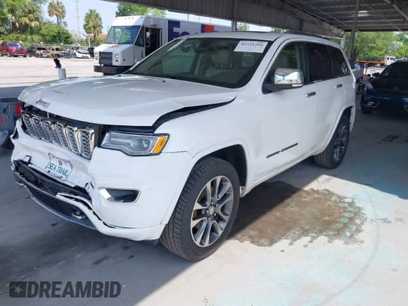 2018 Jeep Grand Cherokee Overland with VIN 1C4RJFCG8JC229381, listed as a IAAI auction lot 42221266 with 102,230 mi miles and . Bid and sale history available at DreamBid. Image 17.