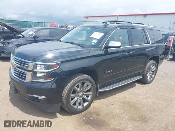 2018 Chevrolet Tahoe Premier with VIN 1GNSKCKC8JR104865, listed as a IAAI auction lot 42771057 with 123,387 mi miles and . Bid and sale history available at DreamBid. Image 17.