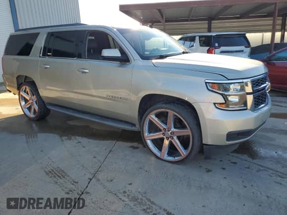2015 Chevrolet Suburban LT with VIN 1GNSCJKC7FR266432, listed as a Copart auction lot 86607115 with 184,559 mi miles and Clean title. Bid and sale history available at DreamBid. Image 4.