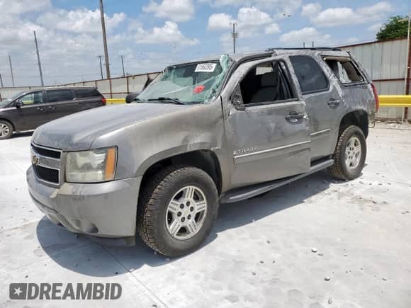 2007 Chevrolet Tahoe LS with VIN 1GNFC13C07J340290, listed as a Copart auction lot 61860395 with 207,574 mi miles and Salvage title. Bid and sale history available at DreamBid. Image 1.