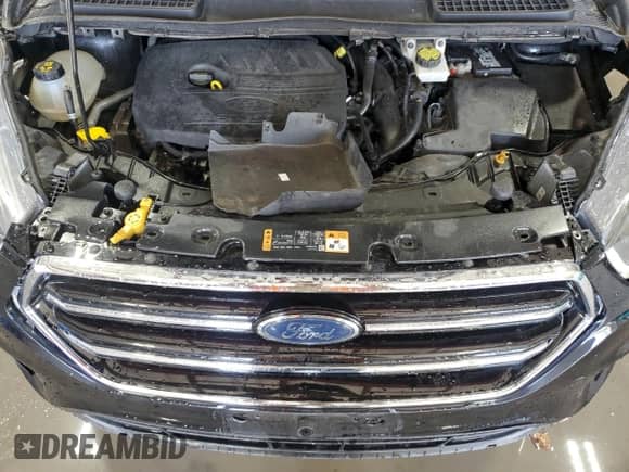 2018 Ford Escape SE with VIN 1FMCU9GD2JUC25153, listed as a Copart auction lot 87018485 with 104,172 mi miles and Salvage title. Bid and sale history available at DreamBid. Image 12.