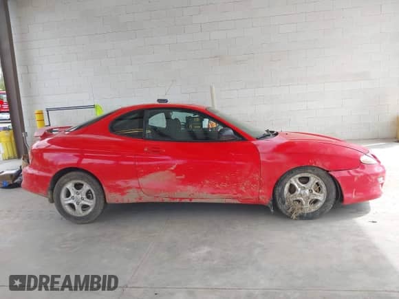 2000 Hyundai Tiburon с VIN KMHJG25F5YU215267, выставлен на аукционе IAAI как лот 42322522 с пробегом 162 683 миль миль и . История ставок и продаж доступна на DreamBid. Изображение 13.