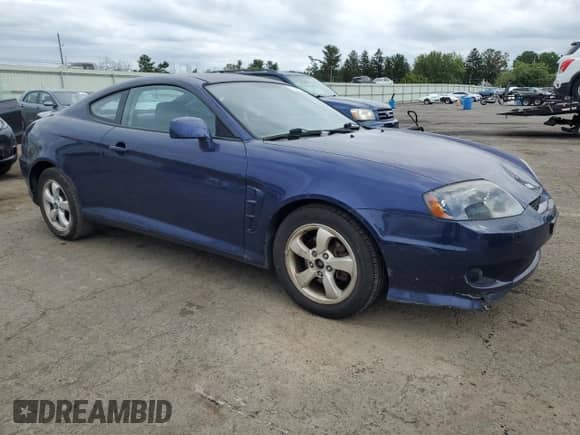 2006 Hyundai Tiburon GS с VIN KMHHM65D26U229878, выставлен на аукционе Copart как лот 70600534 с пробегом 140 245 миль миль и Списание • Salvage title. История ставок и продаж доступна на DreamBid. Изображение 4.