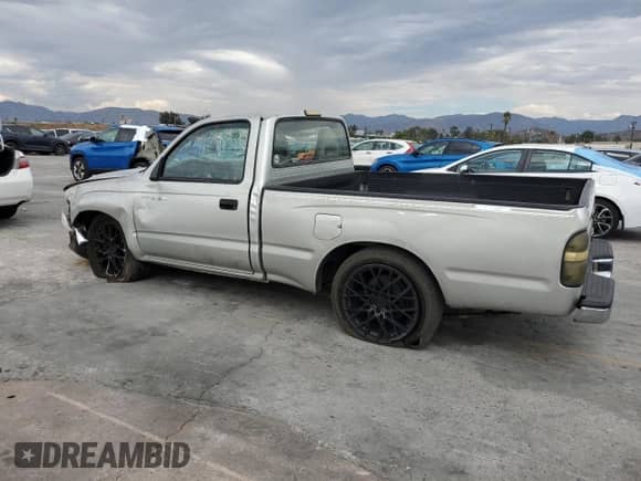 2002 Toyota Tacoma with VIN 5TENL42N82Z080549, listed as a Copart auction lot 80899715 with 115,239 mi miles and Salvage title. Bid and sale history available at DreamBid. Image 2.