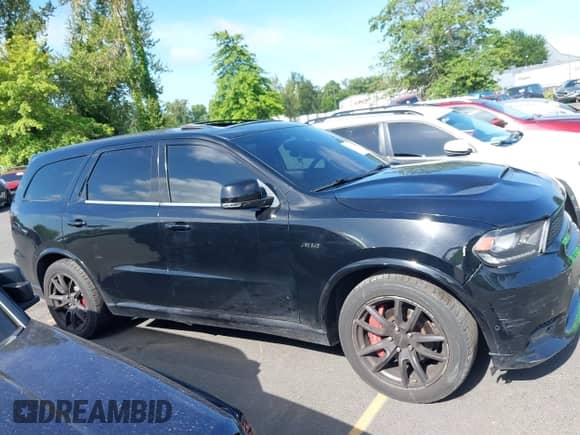 2018 Dodge Durango SRT with VIN 1C4SDJGJ5JC142443, listed as a IAAI auction lot 42401246 with 106,260 mi miles and . Bid and sale history available at DreamBid. Image 13.