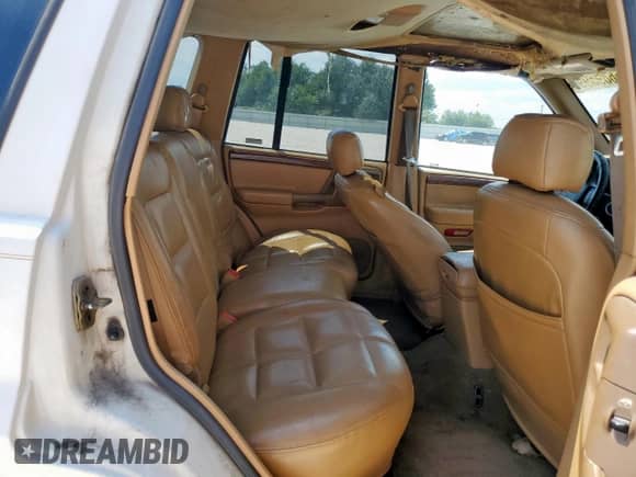1998 Jeep Grand Cherokee Limited с VIN 1J4GZ78Y4WC112941, выставлен на аукционе Copart как лот 66895995 с пробегом Не указан миль и Списание • Salvage title. История ставок и продаж доступна на DreamBid. Изображение 11.