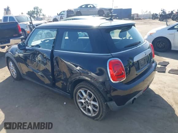 2014 MINI Hardtop with VIN WMWXM5C53ET934731, listed as a IAAI auction lot 43345367 with 48,628 mi miles and . Bid and sale history available at DreamBid. Image 3.