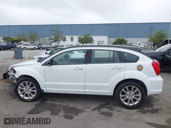 2011 Dodge Caliber Heat with VIN 1B3CB5HA1BD172908, listed as a IAAI auction lot 43438551 with 153,540 mi miles and . Bid and sale history available at DreamBid. Image 14.