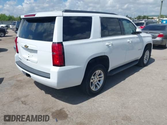 2018 Chevrolet Tahoe LS with VIN 1GNSKAKC8JR299452, listed as a IAAI auction lot 42575012 with 153,402 mi miles and . Bid and sale history available at DreamBid. Image 4.
