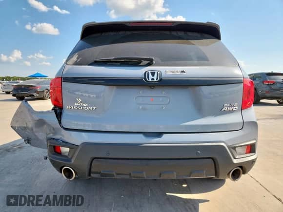 2022 Honda Passport Elite with VIN 5FNYF8H05NB025666, listed as a Copart auction lot 69301095 with 34,758 mi miles and Salvage title. Bid and sale history available at DreamBid. Image 6.