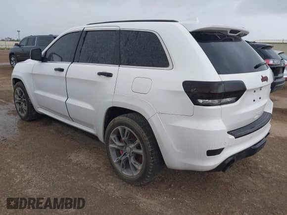 2015 Jeep Grand Cherokee SRT z VIN 1C4RJFDJ8FC951631, wystawiony jako IAAI lot #41277071 z przebiegiem 93 604 mil mil oraz . Historia ofert i sprzedaży dostępna na DreamBid. Obrazek 3.