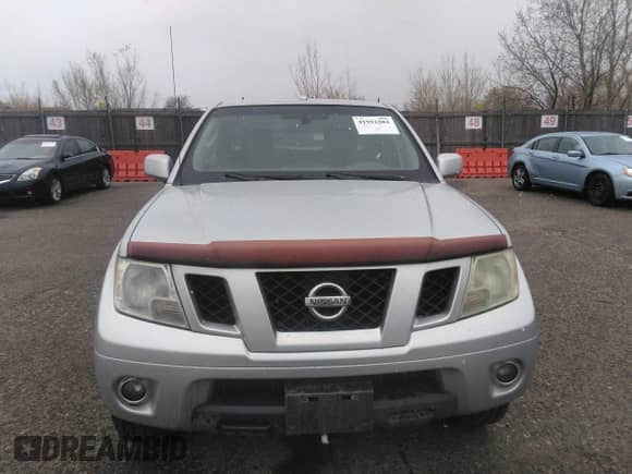 2011 Nissan Frontier Pro-4X with VIN 1N6AD0EV2BC438370, listed as a IAAI auction lot 41952484 with 217,529 mi miles and . Bid and sale history available at DreamBid. Image 12.