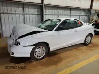 1997 Hyundai Tiburon с VIN KMHJG24M6VU052589, выставлен на аукционе Copart как лот 45118235 с пробегом 90 609 миль миль и Списание • Salvage title. История ставок и продаж доступна на DreamBid. Изображение 1.