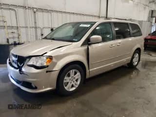 2013 Dodge Grand Caravan Crew with VIN 2C4RDGDG6DR700029, listed as a Copart auction lot 69057705 with 64,797 mi miles and Salvage title. Bid and sale history available at DreamBid. Image 1.
