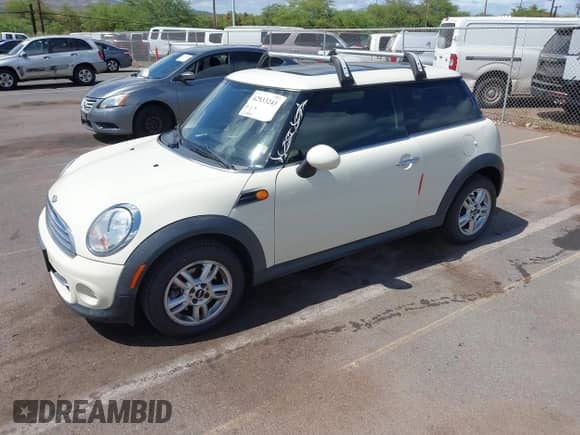2012 MINI Hardtop with VIN WMWSU3C50CT255544, listed as a IAAI auction lot 42533243 with 102,422 mi miles and . Bid and sale history available at DreamBid. Image 2.