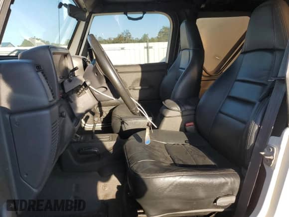 1999 Jeep Wrangler Sport with VIN 1J4FY19SXXP412760, listed as a Copart auction lot 84983895 with 180,172 mi miles and Clean title. Bid and sale history available at DreamBid. Image 7.