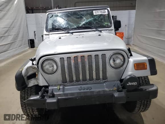 2003 Jeep Wrangler Rubicon с VIN 1J4FA69SX3P322715, выставлен на аукционе Copart как лот 63976635 с пробегом 167 842 миль миль и Списание • Salvage title. История ставок и продаж доступна на DreamBid. Изображение 5.