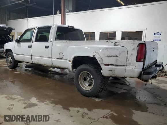 1997 Chevrolet Silverado 3500 с VIN 1GCHC33J5VF002668, выставлен на аукционе Copart как лот 87199575 с пробегом 156 834 миль миль и Чистый • Clean title. История ставок и продаж доступна на DreamBid. Изображение 2.
