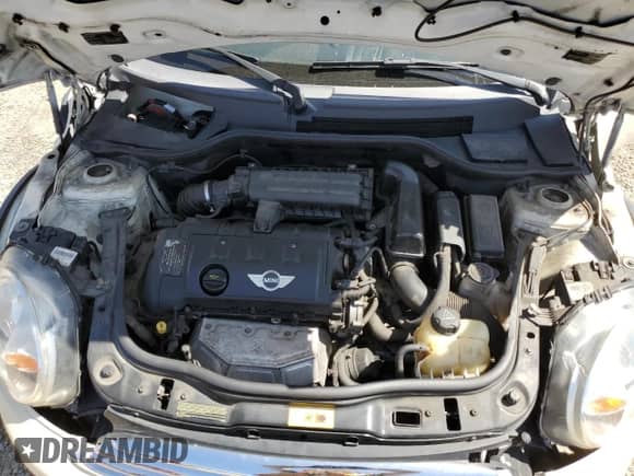 2013 MINI Hardtop with VIN WMWSU3C52DT680782, listed as a Copart auction lot 61779515 with 94,378 mi miles and Salvage title. Bid and sale history available at DreamBid. Image 11.