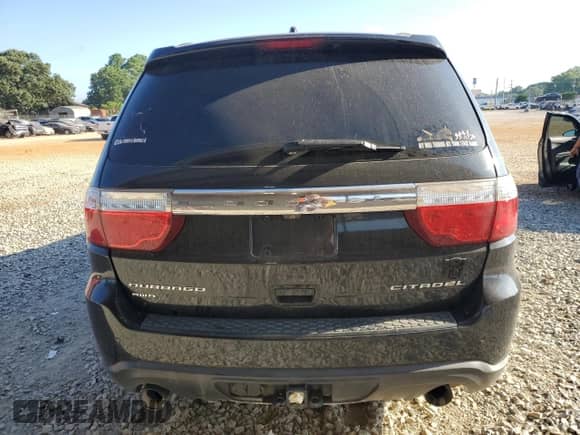 2013 Dodge Durango Citadel with VIN 1C4SDJET6DC583054, listed as a Copart auction lot 65777295 with 145,298 mi miles and Salvage title. Bid and sale history available at DreamBid. Image 6.