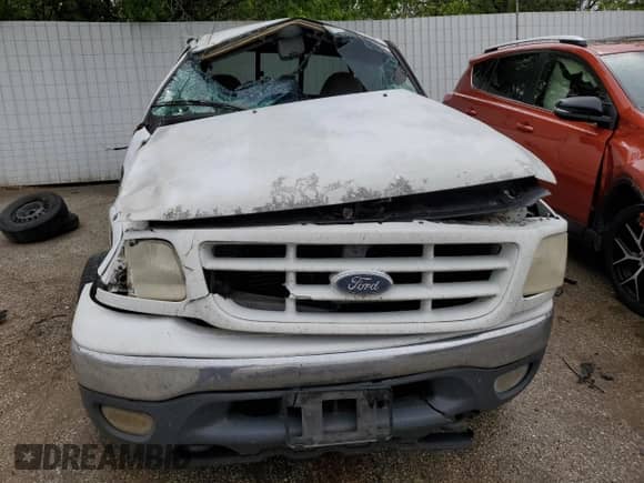 2000 Ford F-150 XL z VIN 2FTPX18L0YCA87613, wystawiony jako Copart lot #52584194 z przebiegiem Nie podano mil oraz Szkoda całkowita • Salvage title. Historia ofert i sprzedaży dostępna na DreamBid. Obrazek 5.