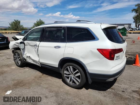 2018 Honda Pilot Touring с VIN 5FNYF6H98JB054611, выставлен на аукционе Copart как лот 70558255 с пробегом Не указан миль и Списание • Salvage title. История ставок и продаж доступна на DreamBid. Изображение 2.
