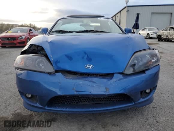 2005 Hyundai Tiburon GT с VIN KMHHN65F45U183144, выставлен на аукционе Copart как лот 87487994 с пробегом 59 582 миль миль и Списание • Salvage title. История ставок и продаж доступна на DreamBid. Изображение 5.