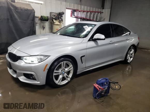 2016 BMW 4 Series 428i xDrive with VIN WBA4C9C52GG137735, listed as a Copart auction lot 42413905 with 79,476 mi miles and Salvage title. Bid and sale history available at DreamBid. Image 1.
