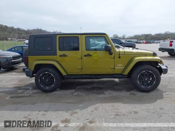 2007 Jeep Wrangler Unlimited Sahara z VIN 1J8GA59167L161894, wystawiony jako IAAI lot #41856064 z przebiegiem 122 714 mil mil oraz . Historia ofert i sprzedaży dostępna na DreamBid. Obrazek 14.