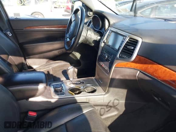 2013 Jeep Grand Cherokee Limited z VIN 1C4RJFBG4DC648995, wystawiony jako IAAI lot #43338050 z przebiegiem 138 551 mil mil oraz . Historia ofert i sprzedaży dostępna na DreamBid. Obrazek 5.