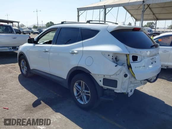 2018 Hyundai Santa Fe 2.4L with VIN 5NMZU3LB6JH057170, listed as a IAAI auction lot 43126111 with 89,888 mi miles and . Bid and sale history available at DreamBid. Image 3.