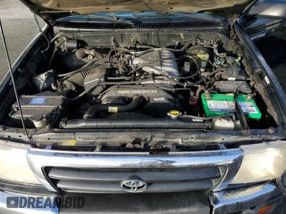 2000 Toyota Tacoma with VIN 5TEWN72N3YZ700698, listed as a Copart auction lot 90316805 with 176,401 mi miles and Salvage title. Bid and sale history available at DreamBid. Image 11.