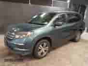 2018 Honda Pilot EX-L with VIN 5FNYF6H7XJB053927, listed as a IAAI auction lot 40659757 with 125,182 mi miles and . Bid and sale history available at DreamBid. Image 2.