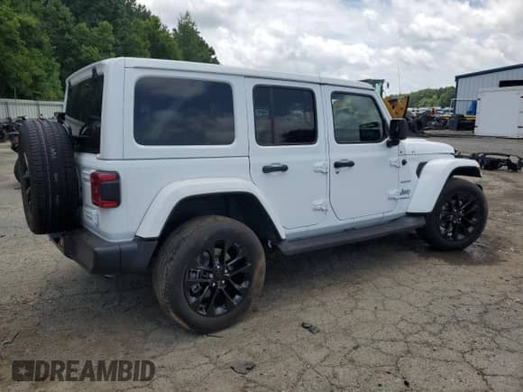 2022 Jeep Wrangler Unlimited Sahara with VIN 1C4JJXP69NW223291, listed as a Copart auction lot 64458055 with 24,574 mi miles and Salvage title. Bid and sale history available at DreamBid. Image 3.
