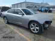 2014 Dodge Charger SXT with VIN 2C3CDXHG4EH305245, listed as a Copart auction lot 84276865 with 166,681 mi miles and Salvage title. Bid and sale history available at DreamBid. Image 4.