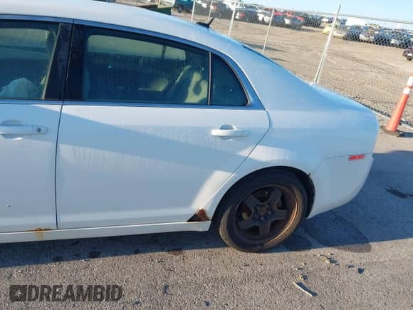 2011 Chevrolet Malibu 1LS with VIN 1G1ZB5E15BF354475, listed as a IAAI auction lot 43059977 with 169,371 mi miles and . Bid and sale history available at DreamBid. Image 13.