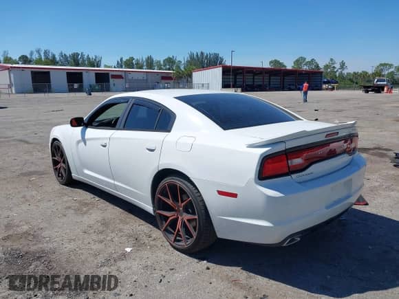 2014 Dodge Charger SE with VIN 2C3CDXBG9EH315018, listed as a IAAI auction lot 41754604 with 103,676 mi miles and . Bid and sale history available at DreamBid. Image 3.