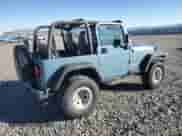 1999 Jeep Wrangler Sport with VIN 1J4FY19S1XP455674, listed as a Copart auction lot 86821605 with 218,356 mi miles and Clean title. Bid and sale history available at DreamBid. Image 3.