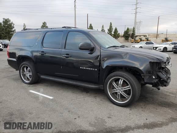 2009 Chevrolet Suburban 2LT с VIN 1GNFC26089R196628, выставлен на аукционе Copart как лот 80308515 с пробегом 279 976 миль миль и Списание • Salvage title. История ставок и продаж доступна на DreamBid. Изображение 4.