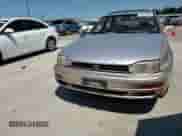 1994 Toyota Camry LE z VIN 4T1SK12E9RU373329, wystawiony jako Copart lot #71214485 z przebiegiem 186 302 mil mil oraz Szkoda całkowita • Salvage title. Historia ofert i sprzedaży dostępna na DreamBid. Obrazek 13.