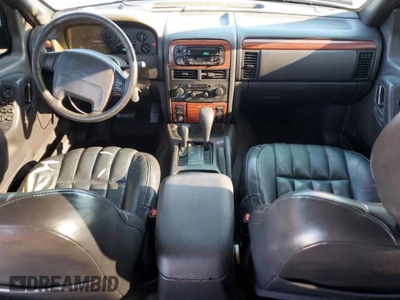 1999 Jeep Grand Cherokee Limited с VIN 1J4GW68N0XC685779, выставлен на аукционе Copart как лот 68852365 с пробегом 148 892 миль миль и Списание • Salvage title. История ставок и продаж доступна на DreamBid. Изображение 8.