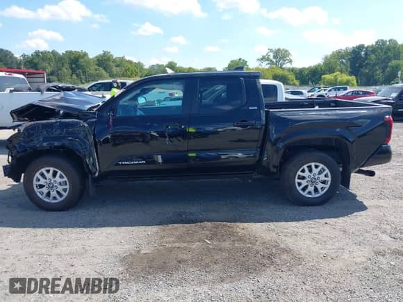 2024 Toyota Tacoma SR5 with VIN 3TMLB5JN7RM077957, listed as a IAAI auction lot 43149381 with 11,806 mi miles and . Bid and sale history available at DreamBid. Image 14.