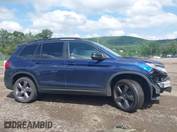 2021 Honda Passport Touring with VIN 5FNYF8H94MB008788, listed as a IAAI auction lot 42545958 with 87,512 mi miles and . Bid and sale history available at DreamBid. Image 14.