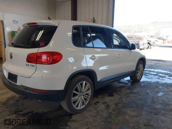 2013 Volkswagen Tiguan with VIN WVGCV3AX7DW605594, listed as a IAAI auction lot 42057457 with 131,629 mi miles and . Bid and sale history available at DreamBid. Image 4.