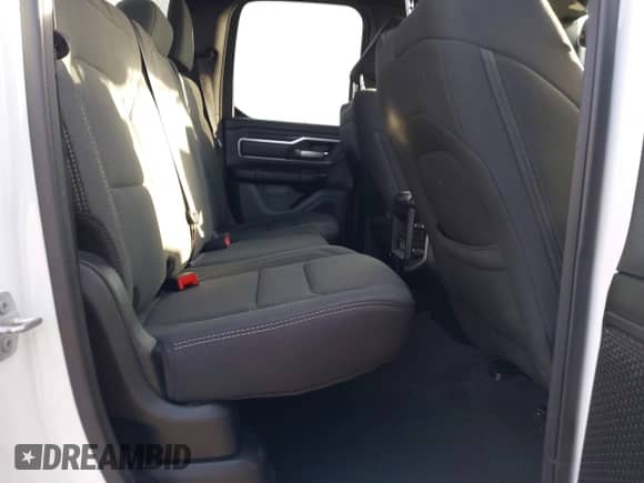 2023 Ram 1500 Lone Star z VIN 1C6RREBT8PN553095, wystawiony jako IAAI lot #41647688 z przebiegiem 18 574 mil mil oraz . Historia ofert i sprzedaży dostępna na DreamBid. Obrazek 8.