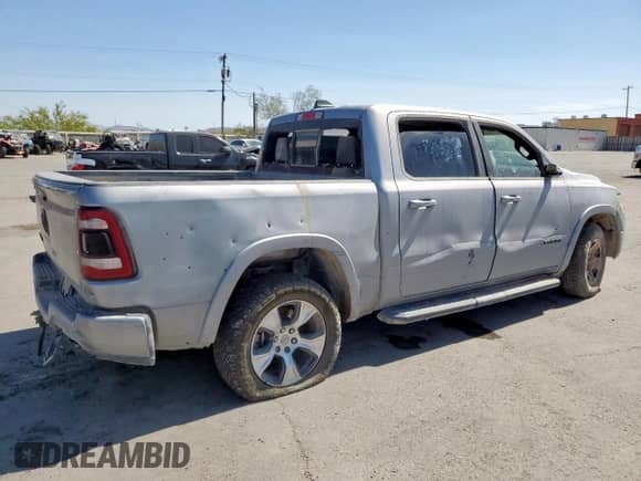 2021 Ram 1500 Laramie z VIN 1C6RREJT2MN593816, wystawiony jako Copart lot #62094565 z przebiegiem 59 825 mil mil oraz Szkoda całkowita • Salvage title. Historia ofert i sprzedaży dostępna na DreamBid. Obrazek 3.