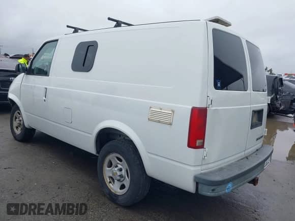 2003 Chevrolet Astro Cargo z VIN 1GCDM19XX3B137256, wystawiony jako IAAI lot #41807199 z przebiegiem 134 275 mil mil oraz . Historia ofert i sprzedaży dostępna na DreamBid. Obrazek 3.