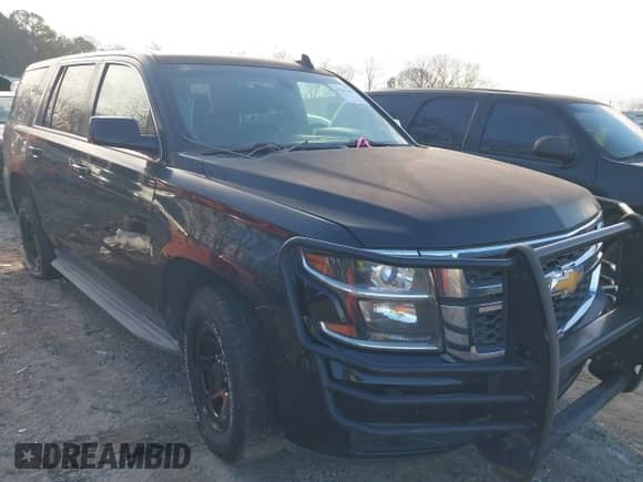2015 Chevrolet Tahoe Commercial with VIN 1GNLC2EC4FR535329, listed as a IAAI auction lot 41643486 with 185,326 mi miles and . Bid and sale history available at DreamBid. Image 1.