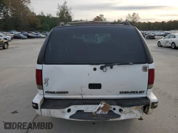 1999 Chevrolet Blazer LT z VIN 1GNDT13W1X2163194, wystawiony jako Copart lot #82897414 z przebiegiem Nie podano mil oraz Szkoda całkowita • Salvage title. Historia ofert i sprzedaży dostępna na DreamBid. Obrazek 6.