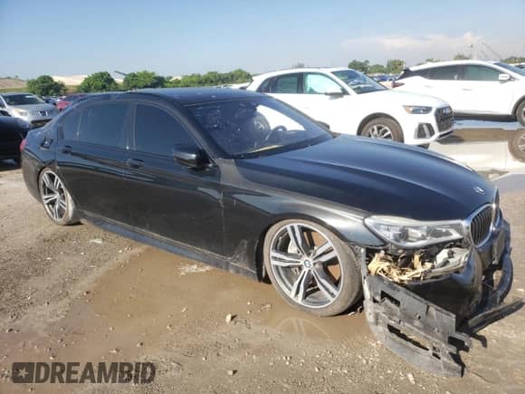 2018 BMW 7 Series 750i with VIN WBA7F0C58JGM23726, listed as a Copart auction lot 69116685 with 32,765 mi miles and Salvage title. Bid and sale history available at DreamBid. Image 4.